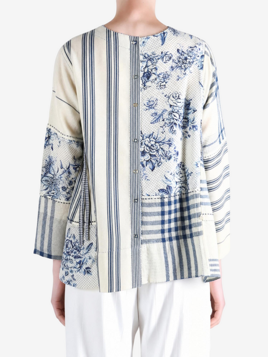 Blue top worn by a person, showing the top fit
