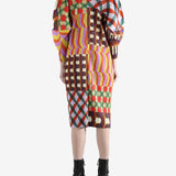 Pink coat worn by a person, showing the coat fit