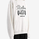 Tan hoodie worn by a person, showing the hoodie fit