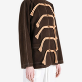 Brown jacket worn by a person, showing the jacket fit