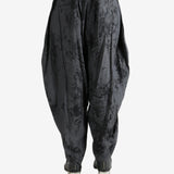 Black pant worn by a person, showing the pant's fit