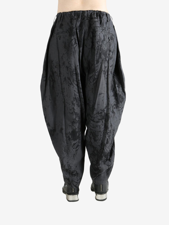 Black pant worn by a person, showing the pant's fit