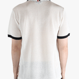 White shirt worn by a person, showing the shirt fit