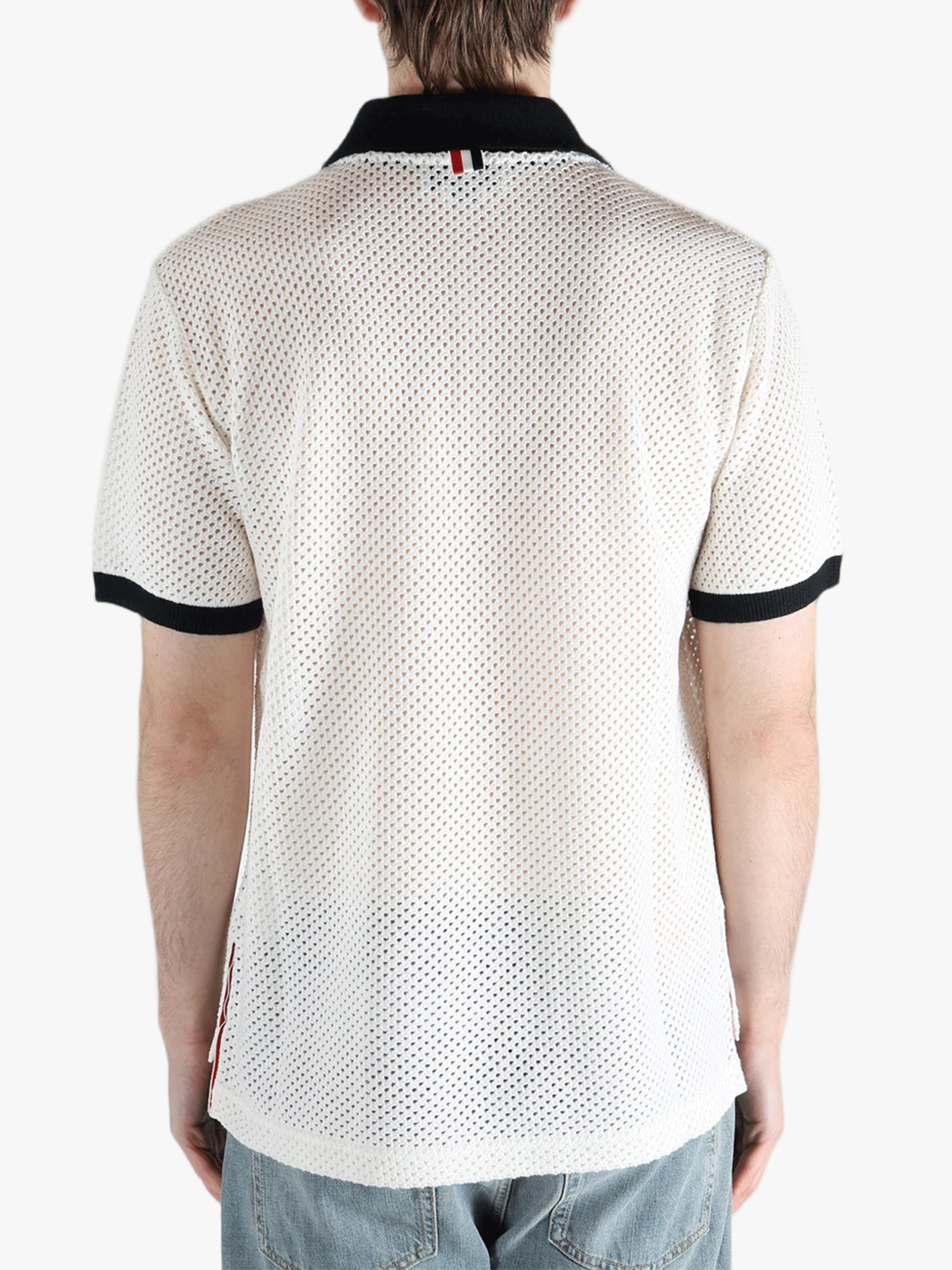 White shirt worn by a person, showing the shirt fit