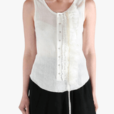 White top worn by a person, showing the top's fit