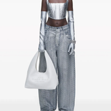 White bag worn by a person, showing the bag's fit