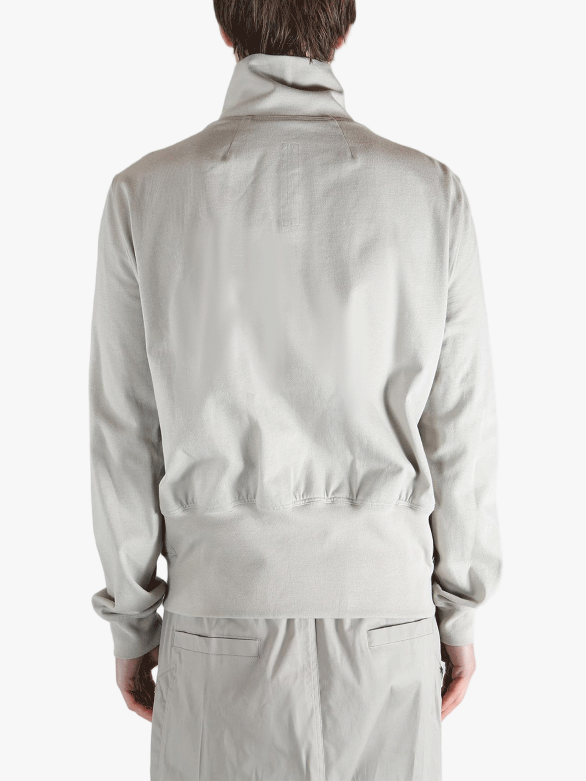 Grey t-shirts worn by a person, showing the t-shirts fit