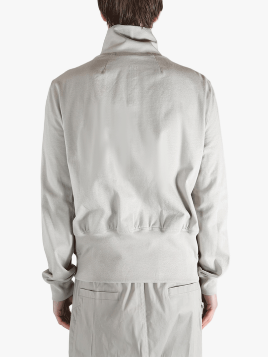 Grey t-shirts worn by a person, showing the t-shirts fit