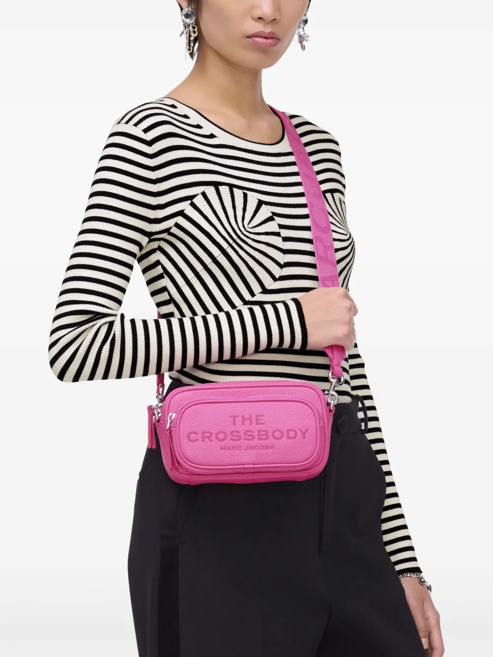Pink bag worn by a person, showing the bag fit