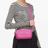 Pink bag worn by a person, showing the bag fit