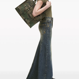 Green bag, worn by a person, showing the bag's fit