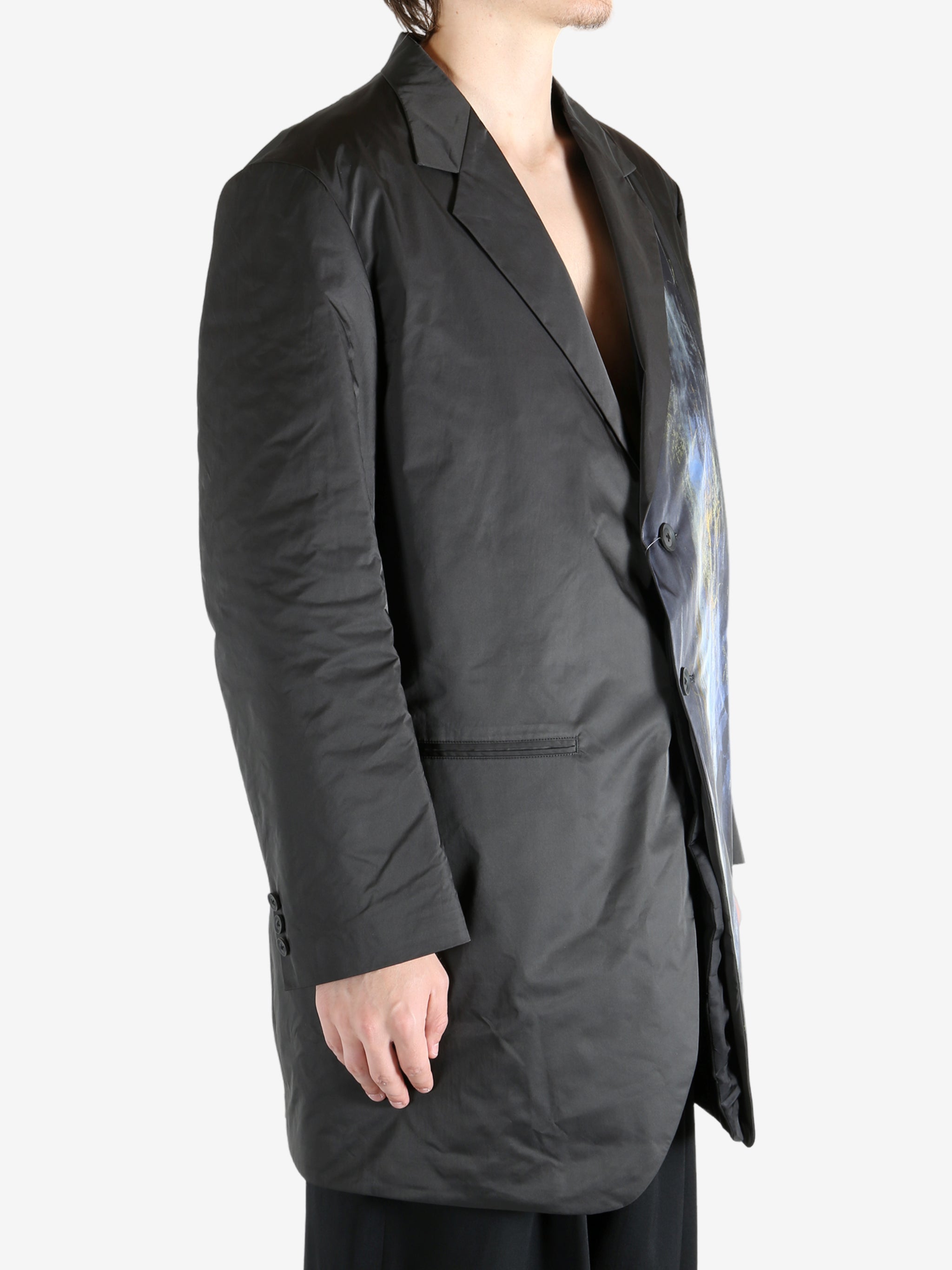 Black jacket worn by a person, showing the jacket's fit