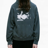 Green hoodie worn by a person, showing the hoodie's fit