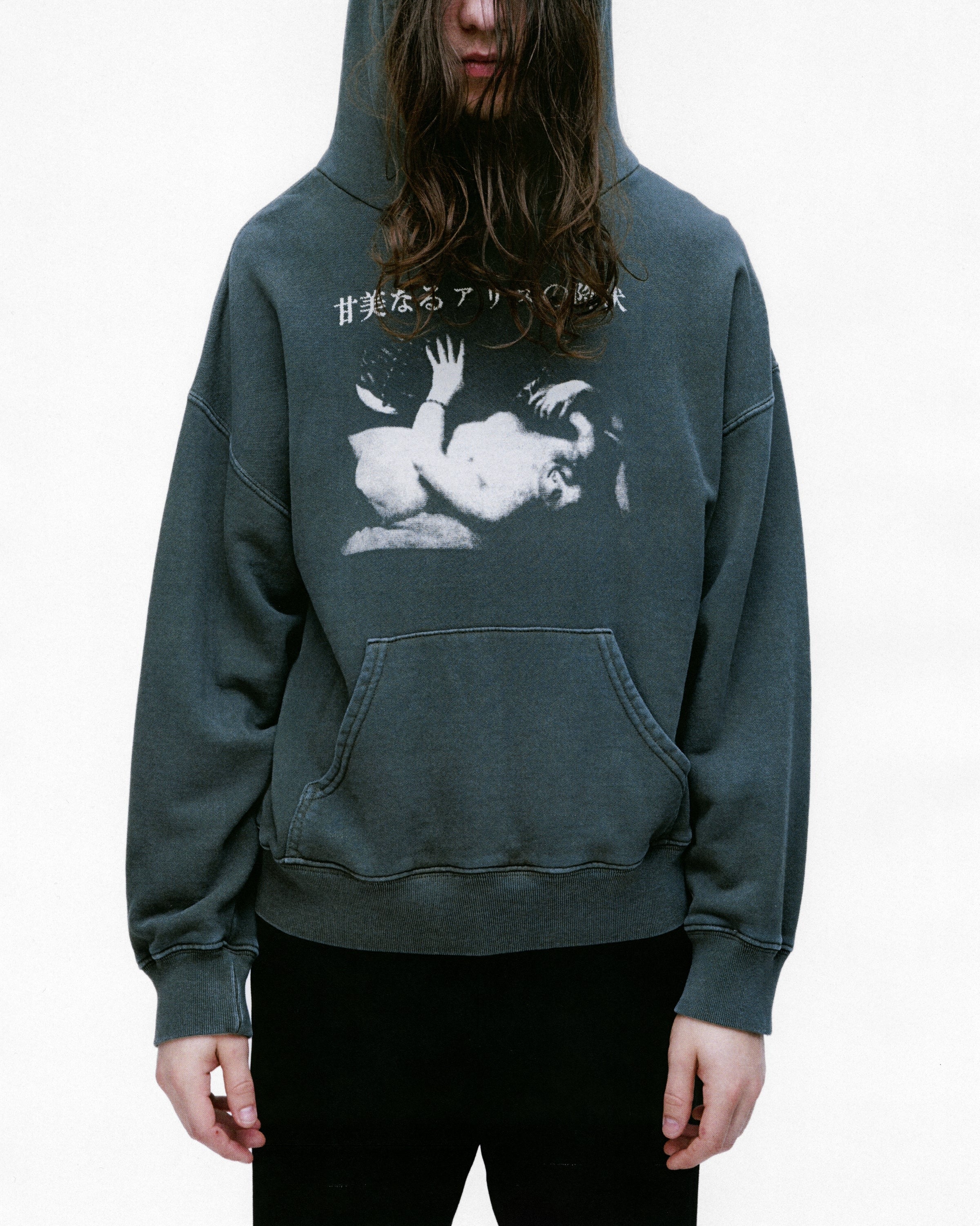 Green hoodie worn by a person, showing the hoodie's fit