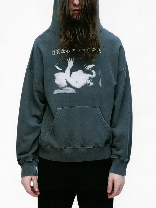 Green hoodie worn by a person, showing the hoodie's fit