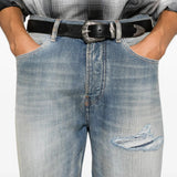 Blue jeans worn by a person, showing the jeans fit