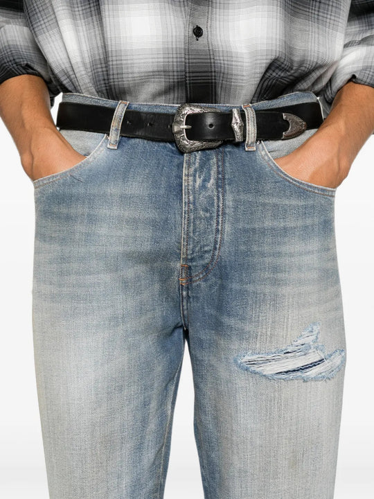 Blue jeans worn by a person, showing the jeans fit
