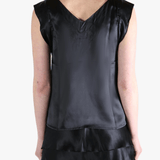 Black top worn by a person, showing the top's fit