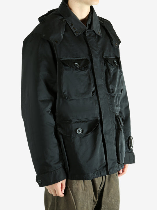 Black jacket worn by a person, showing the jacket's fit