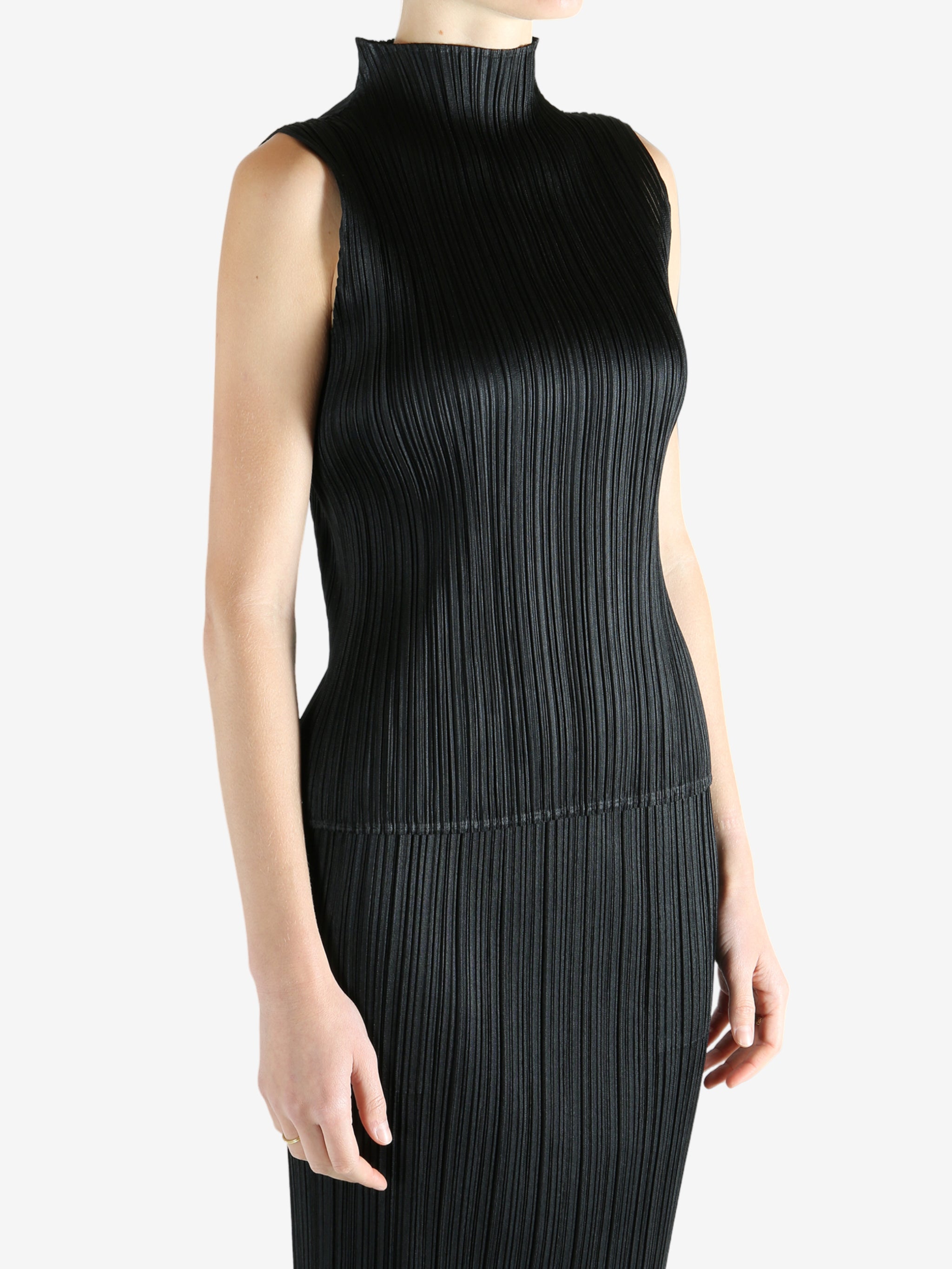 Black shirts worn by a person, showing the shirts fit