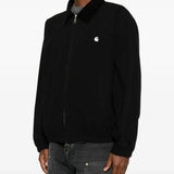 Black jacket worn by a person, showing the jacket fit