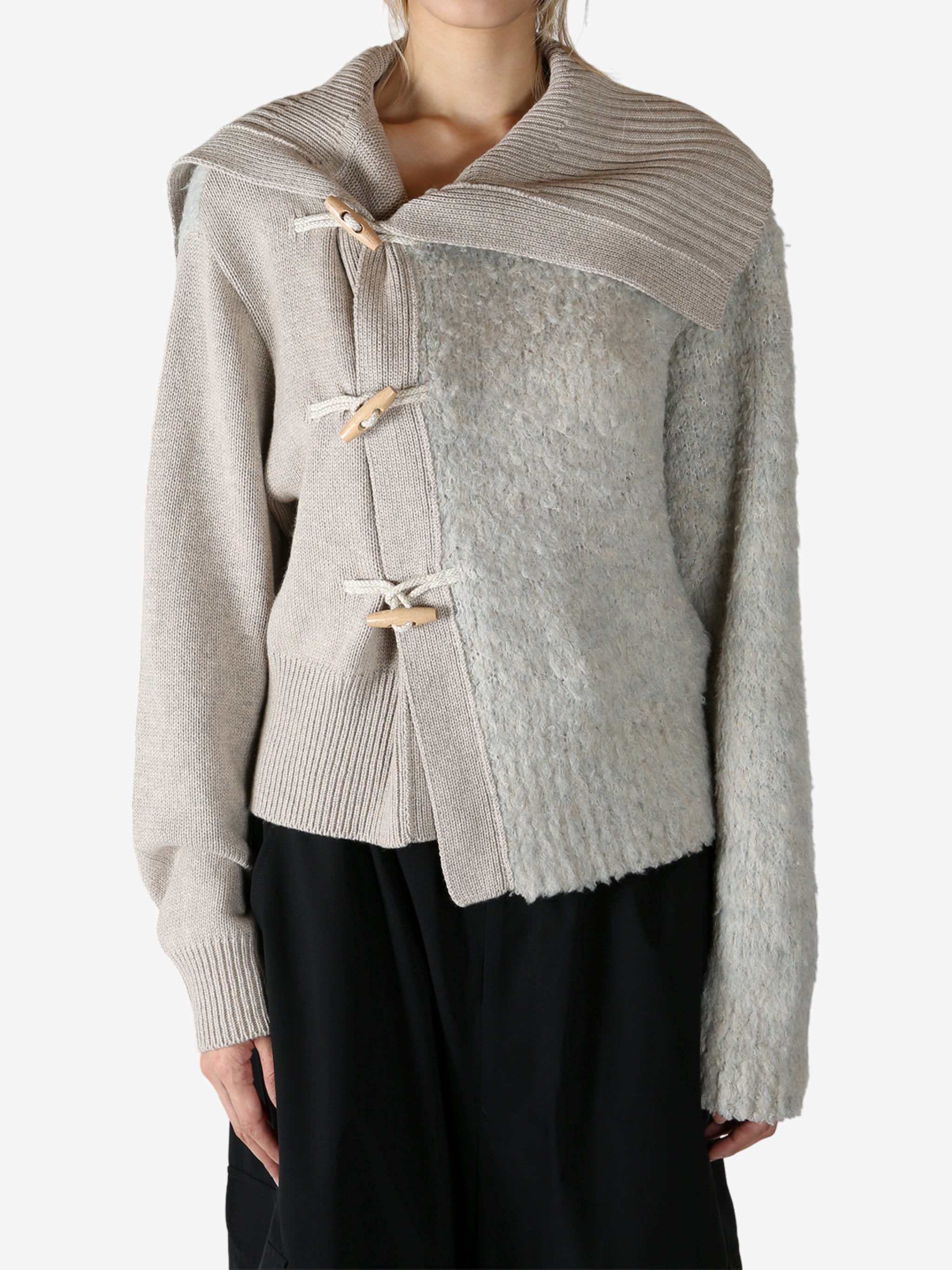 Tan knitwear worn by a person, showing the knitwear fit