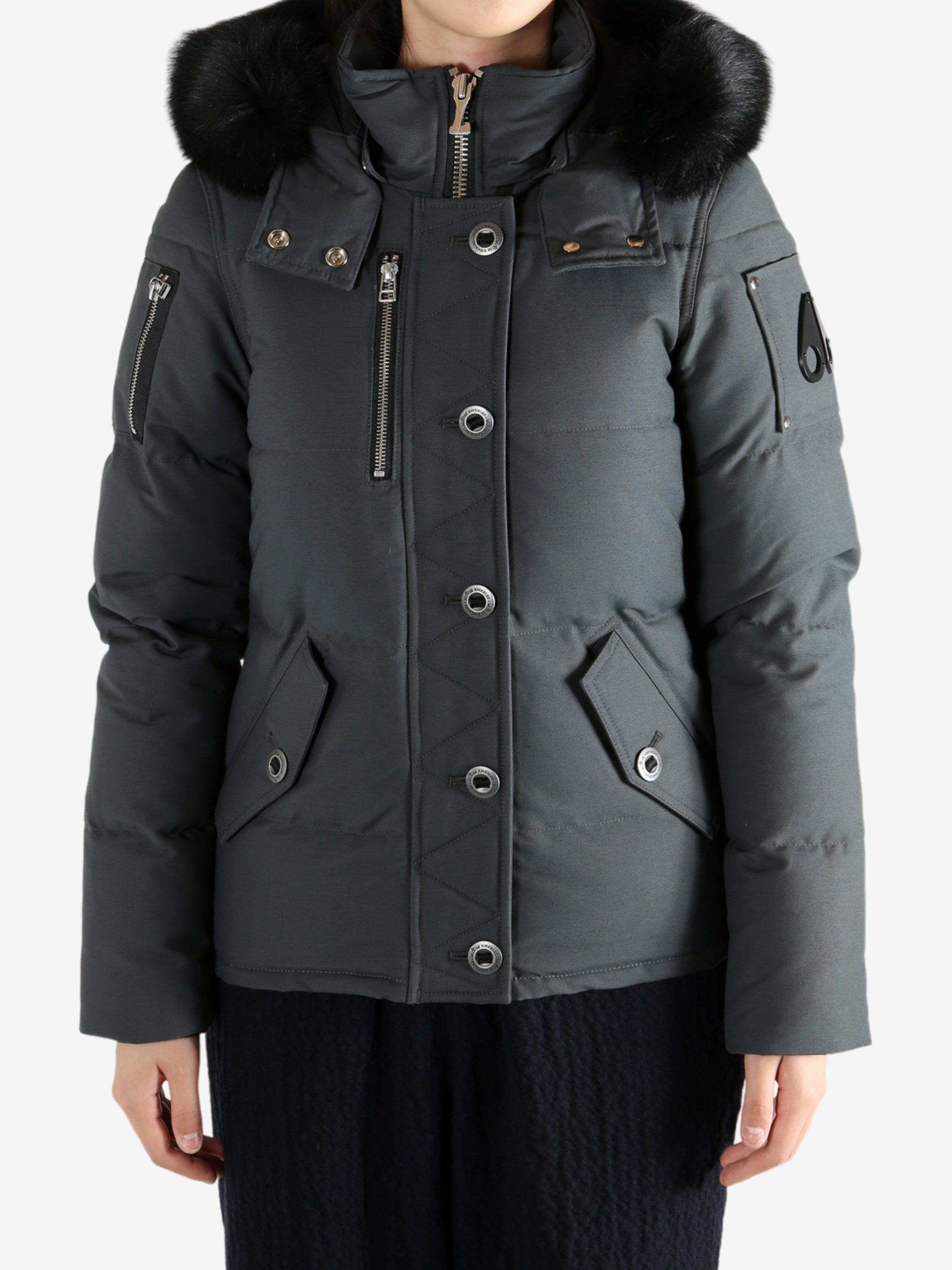 Black jackets worn by a person, showing the jackets fit