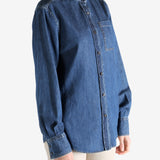 Blue jacket worn by a person, showing the jacket fit