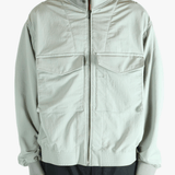 Grey jacket worn by a person, showing the jacket's fit