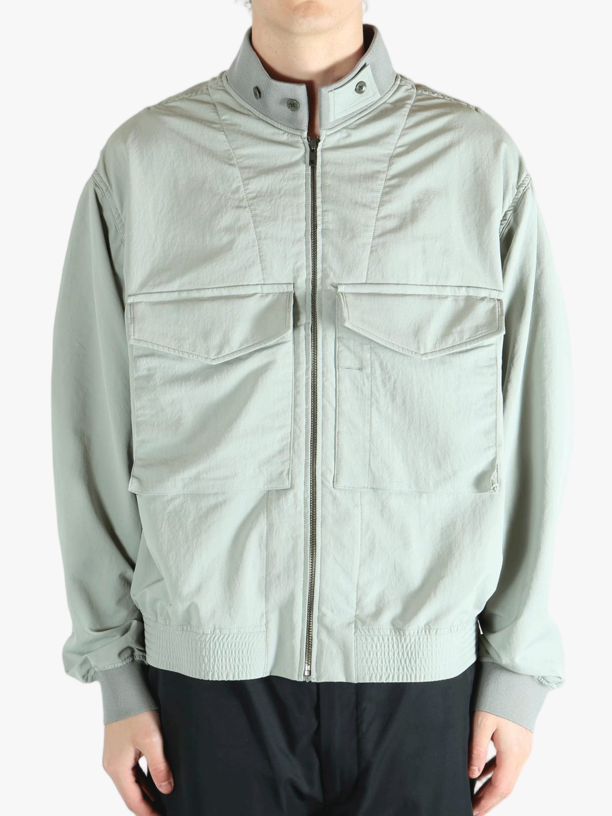 Grey jacket worn by a person, showing the jacket's fit