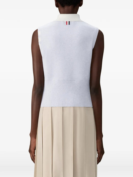 Grey shirts worn by a person, showing the shirts fit