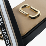 Close up of the tan bag, showing texture of the leather fabric