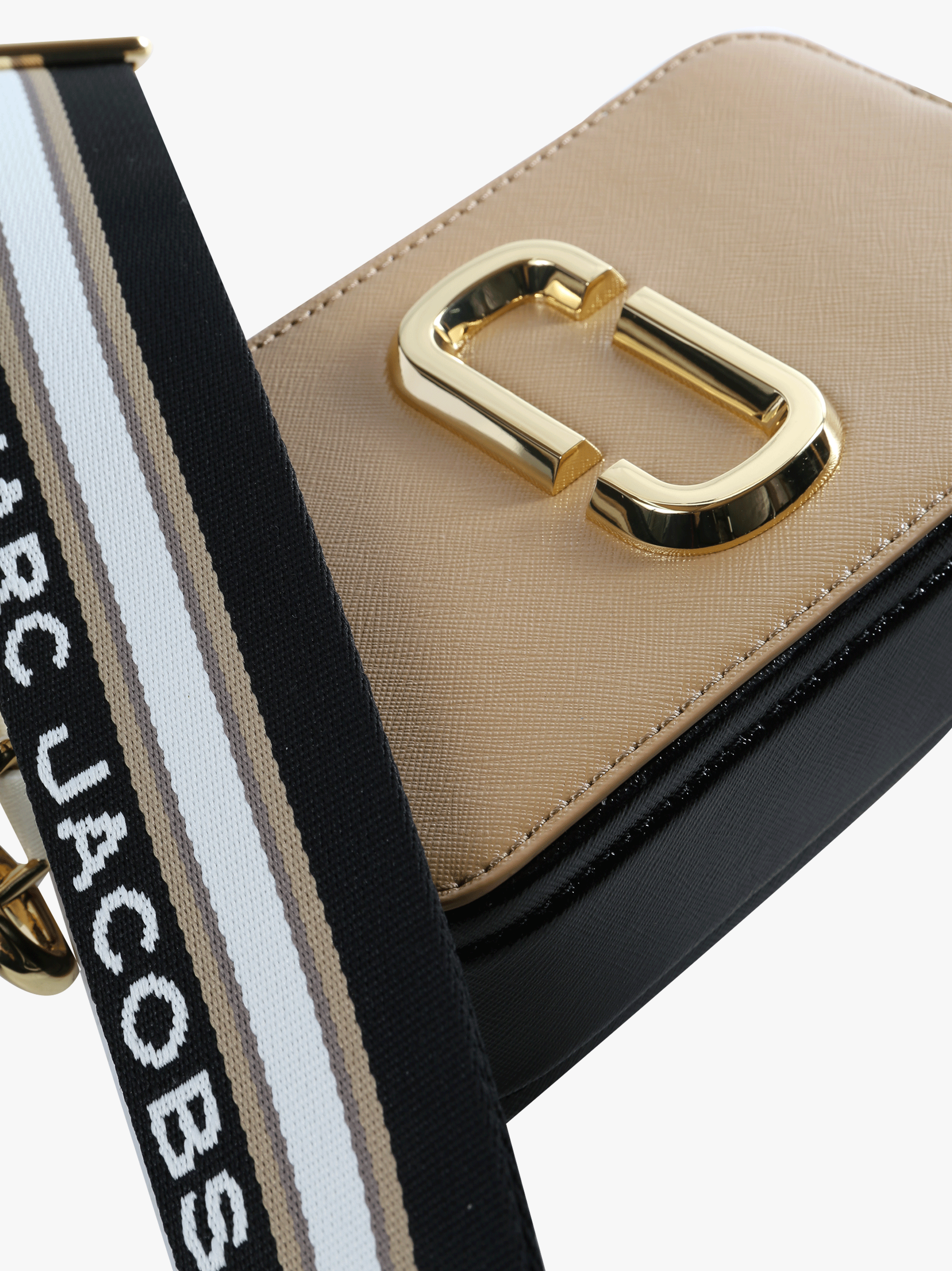 Close up of the tan bag, showing texture of the leather fabric