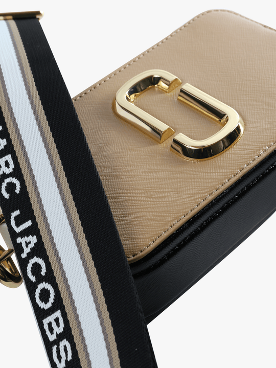 Close up of the tan bag, showing texture of the leather fabric