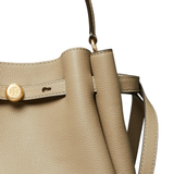 Close up of brown bag, showing texture of the calf leather fabric