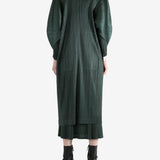 Green coat worn by a person, showing the coat's fit