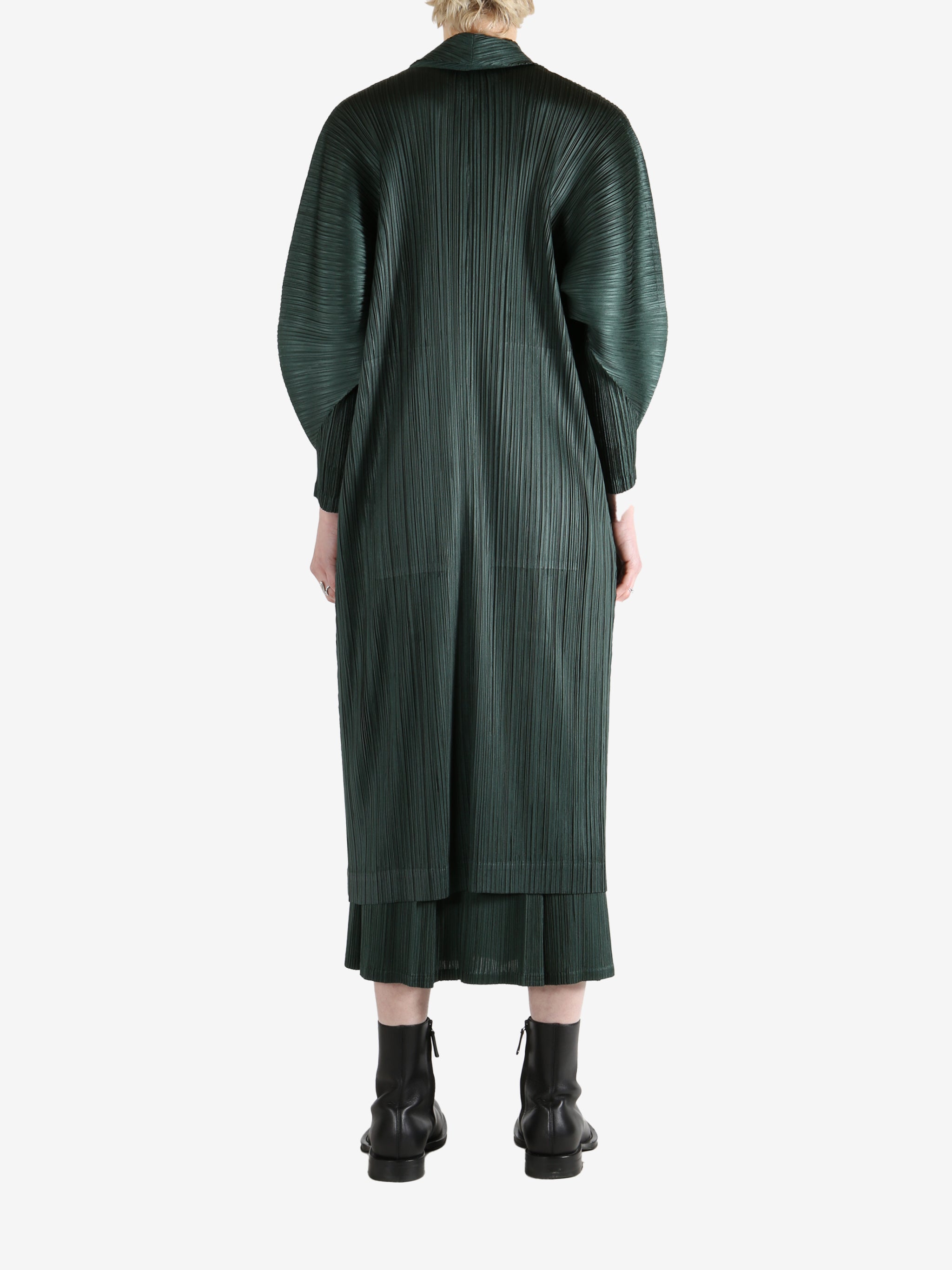 Green coat worn by a person, showing the coat's fit