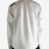 white jacket worn by a person, showing the jacket fit