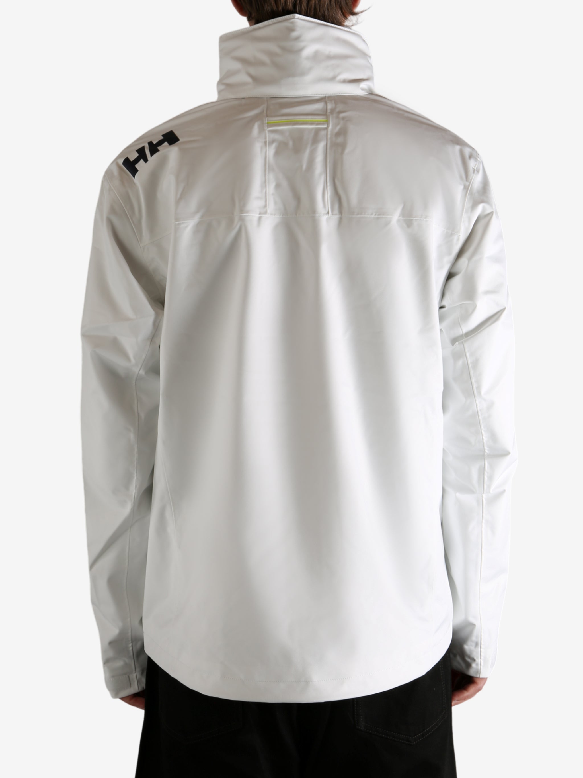 white jacket worn by a person, showing the jacket fit