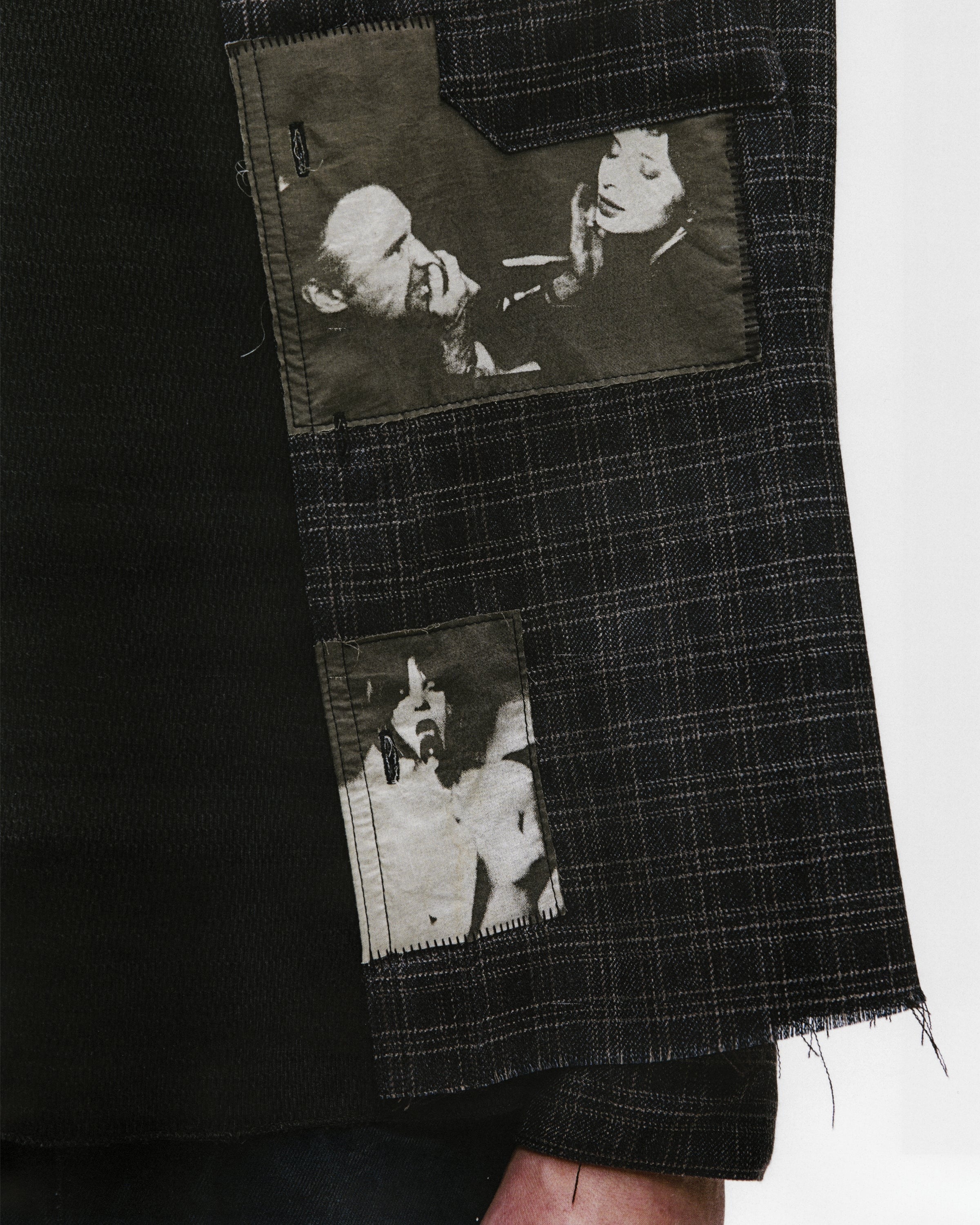 Close up of black shirts, showing texture of the wool fabric