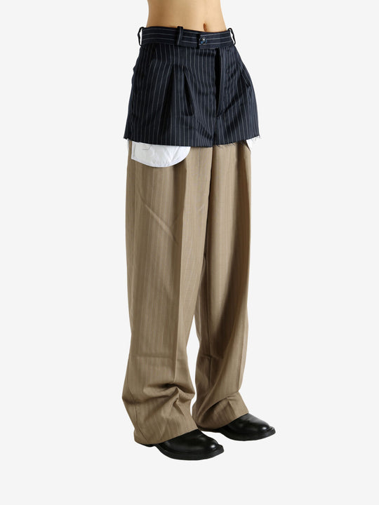 Navy pants worn by a person, showing the pants' fit