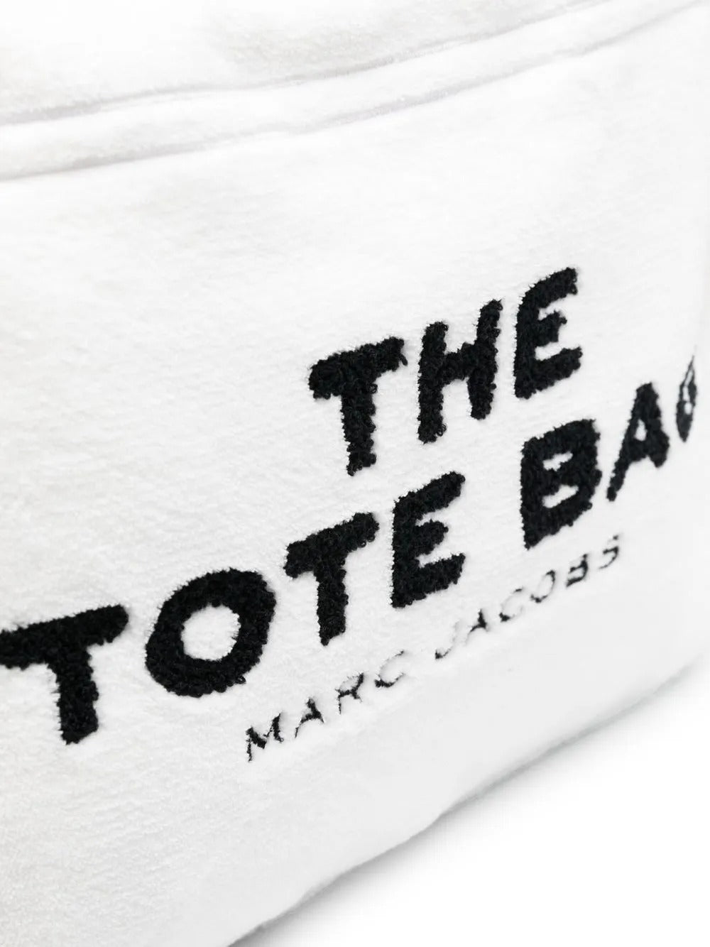 Close up of white bag, showing texture of the polyester fabric