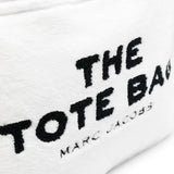 Close up of white bag, showing texture of the polyester fabric