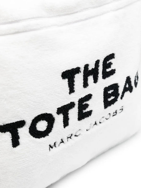 Close up of white bag, showing texture of the polyester fabric