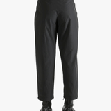 Black pants worn by a person, showing the pants fit