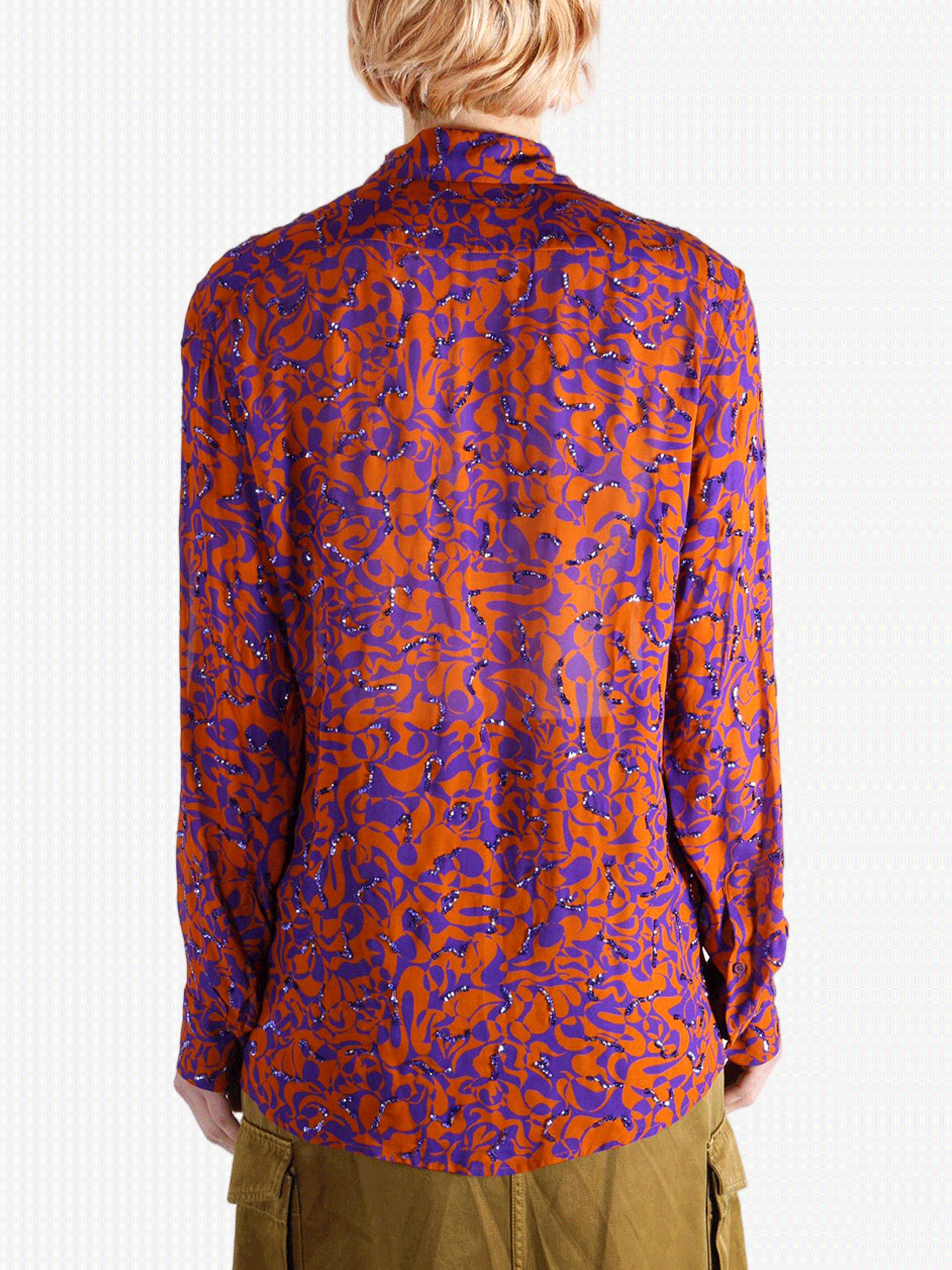 Red top worn by a person, showing the top fit