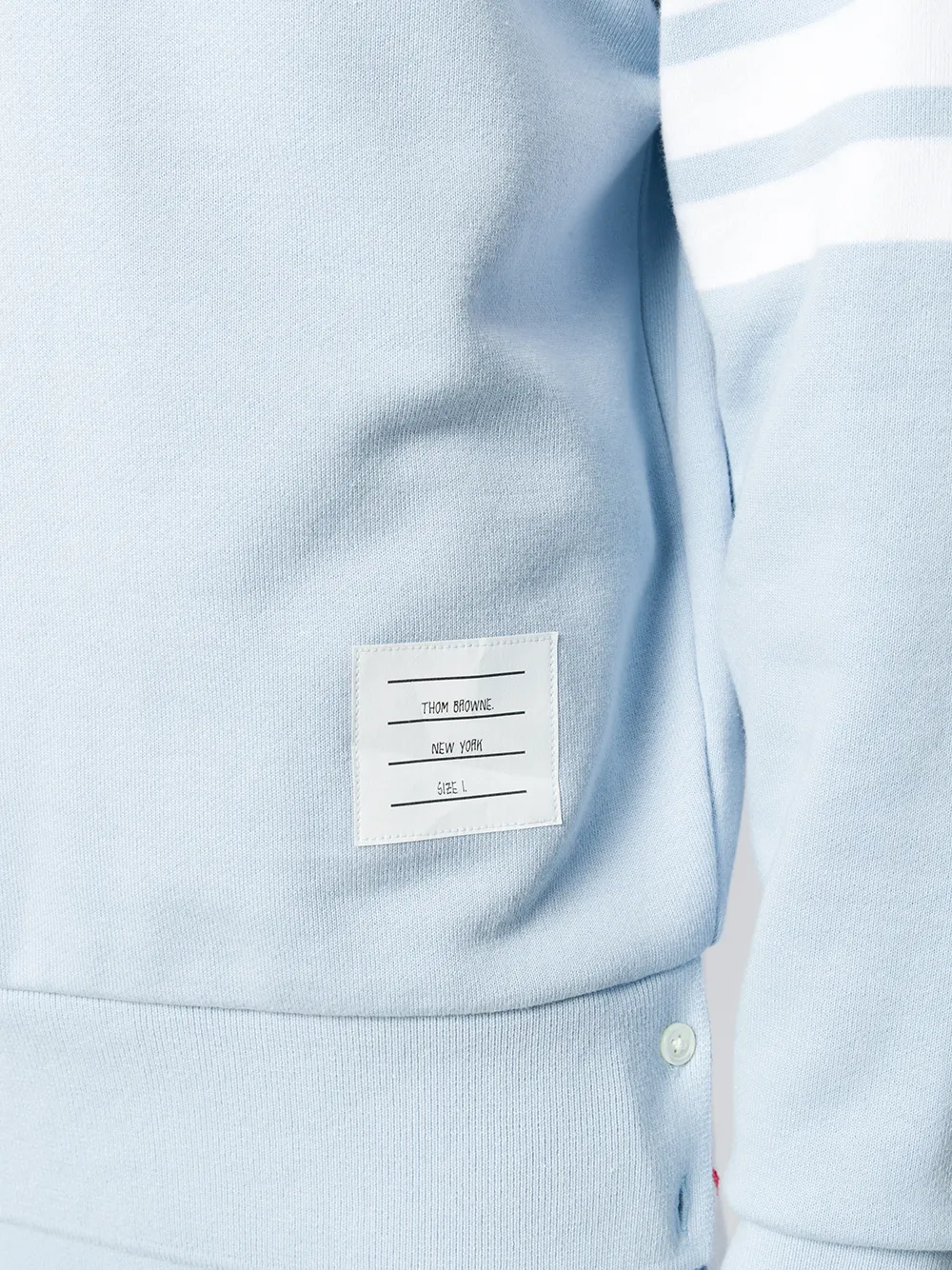 Close up of light blue sweater,showing texture of the cotton fabric.