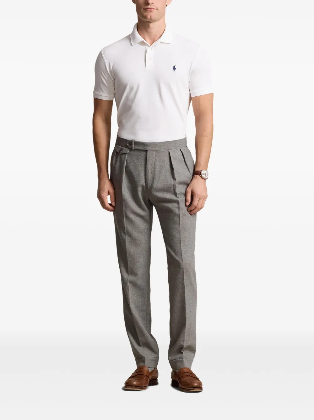 White tee worn by a person, showing the tee's fit