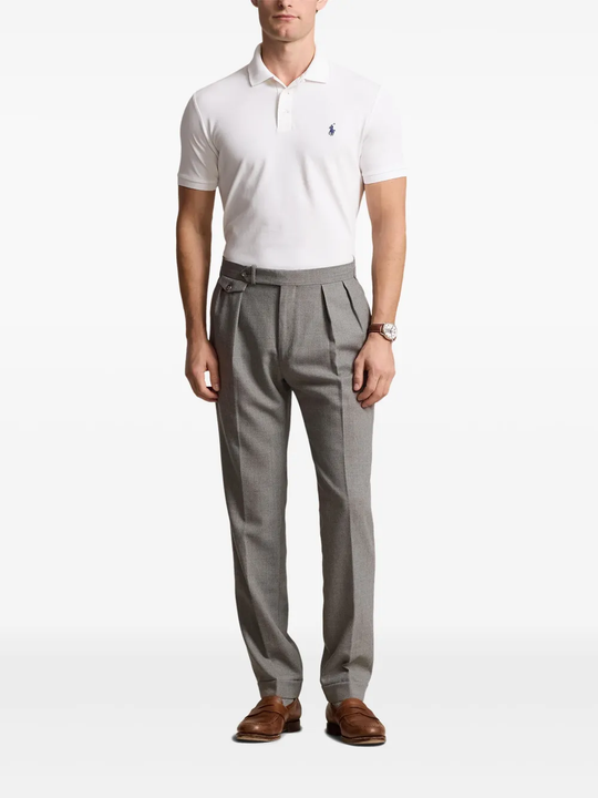 White tee worn by a person, showing the tee's fit