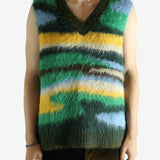 Green vest worn by a person, showing the vest's fit